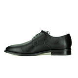 A simple black vegan leather men's dress shoe. Lace up with 4 eyelets, rounded wider toe box. Black sole.