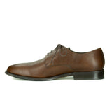 A simple tan vegan leather men's dress shoe. Lace up with 4 eyelets, rounded wider toe box. Dark brown sole.