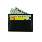 Small cardholder in black vegan leather. 2 card slots on each side and slot in middle. Shown here with cards and cash inside.